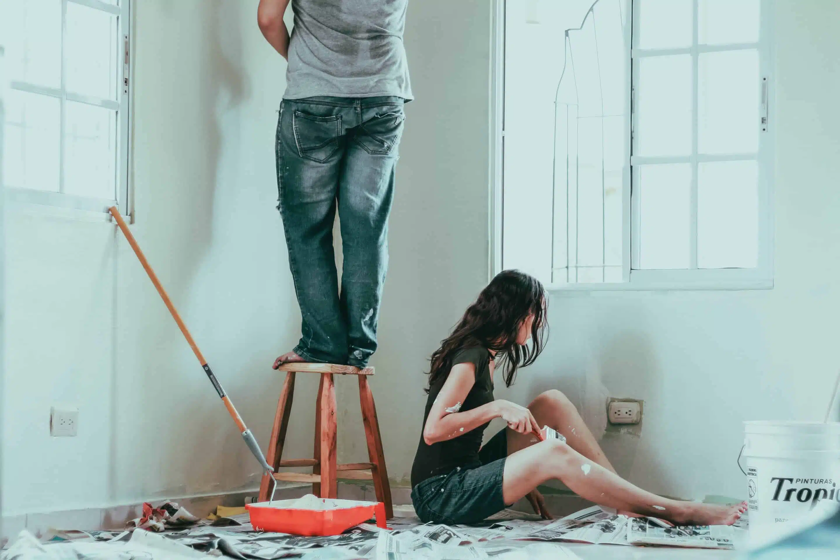 A couple DIYing a home paint job