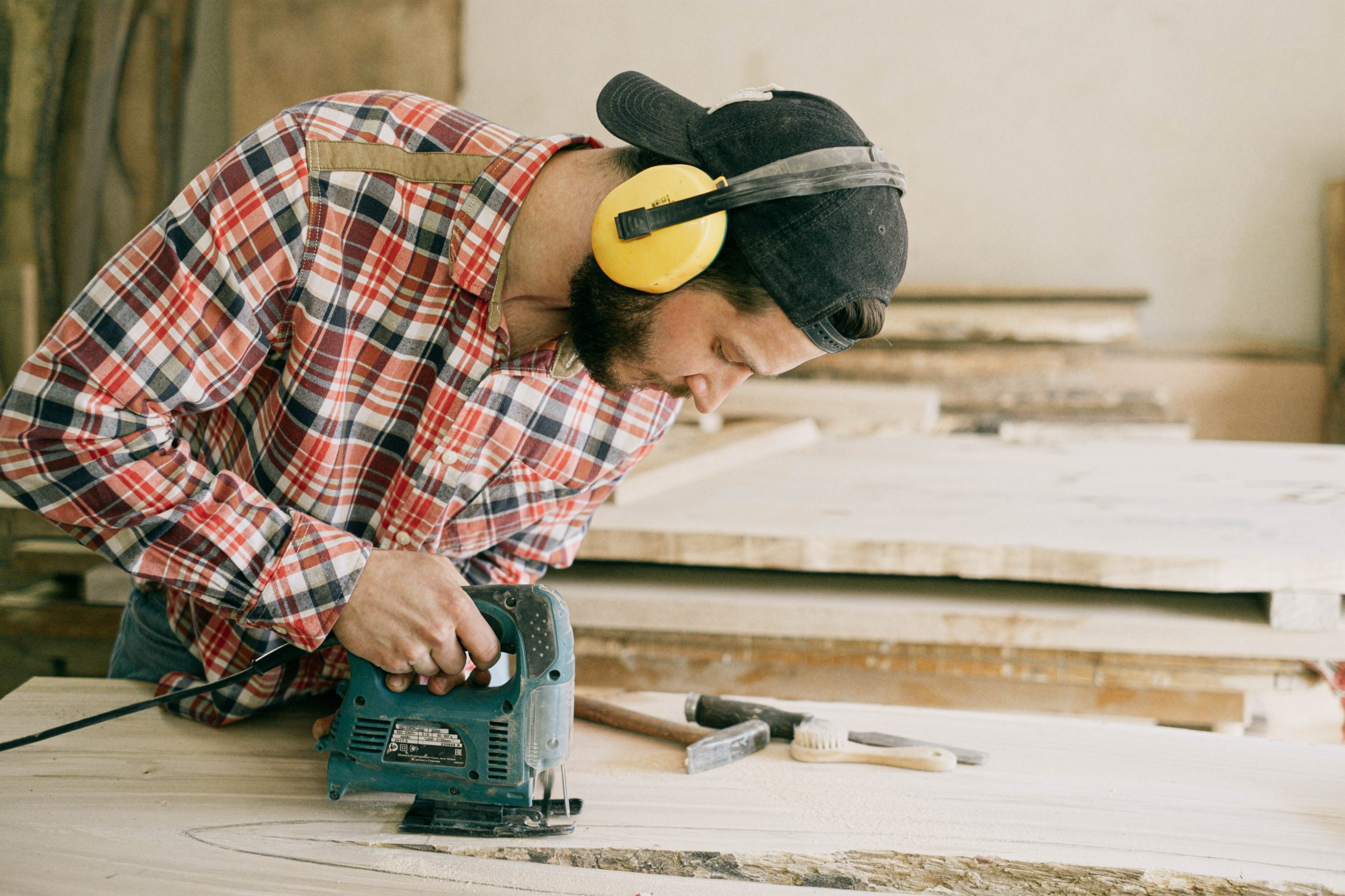Handyman cutting plywood with a jigsaw