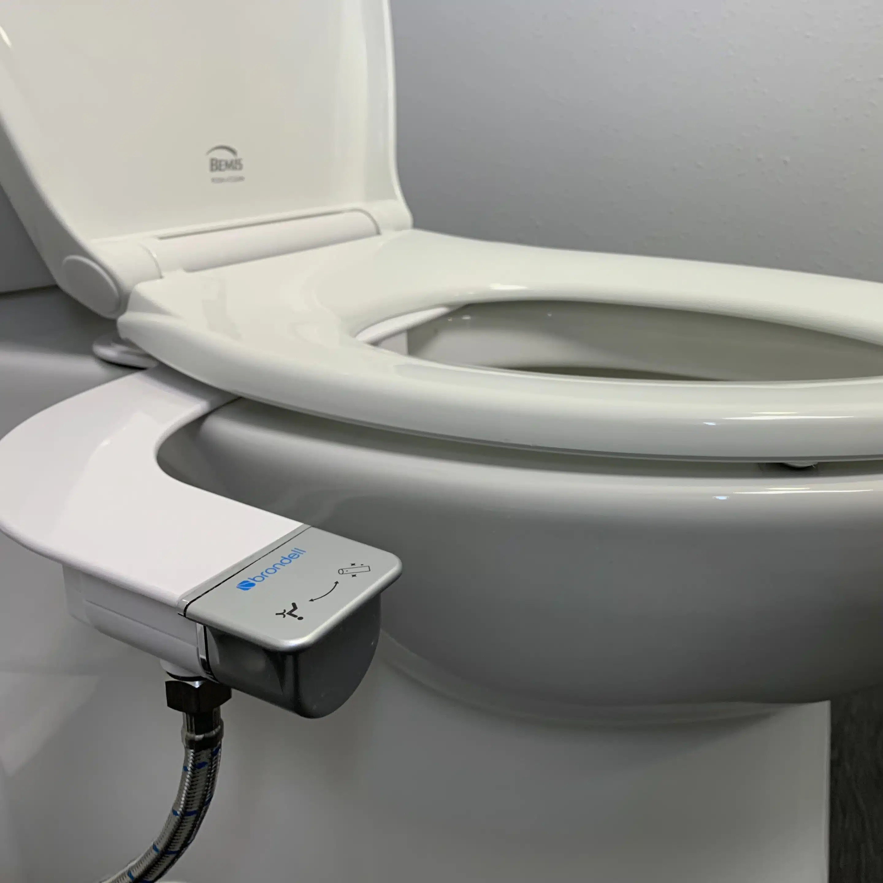 Bidet seat attachment on a toilet