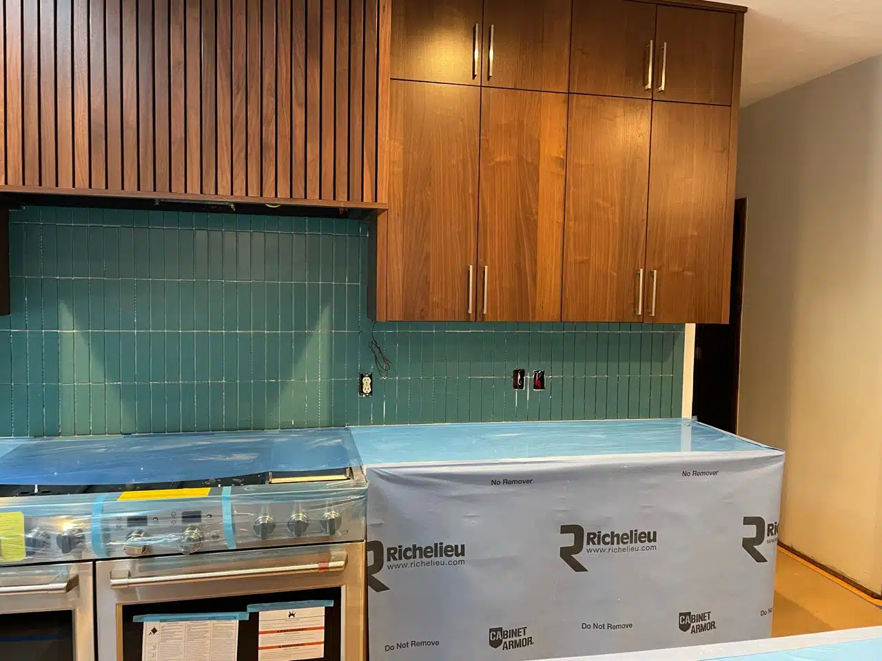 Turquoise backsplash tile installation