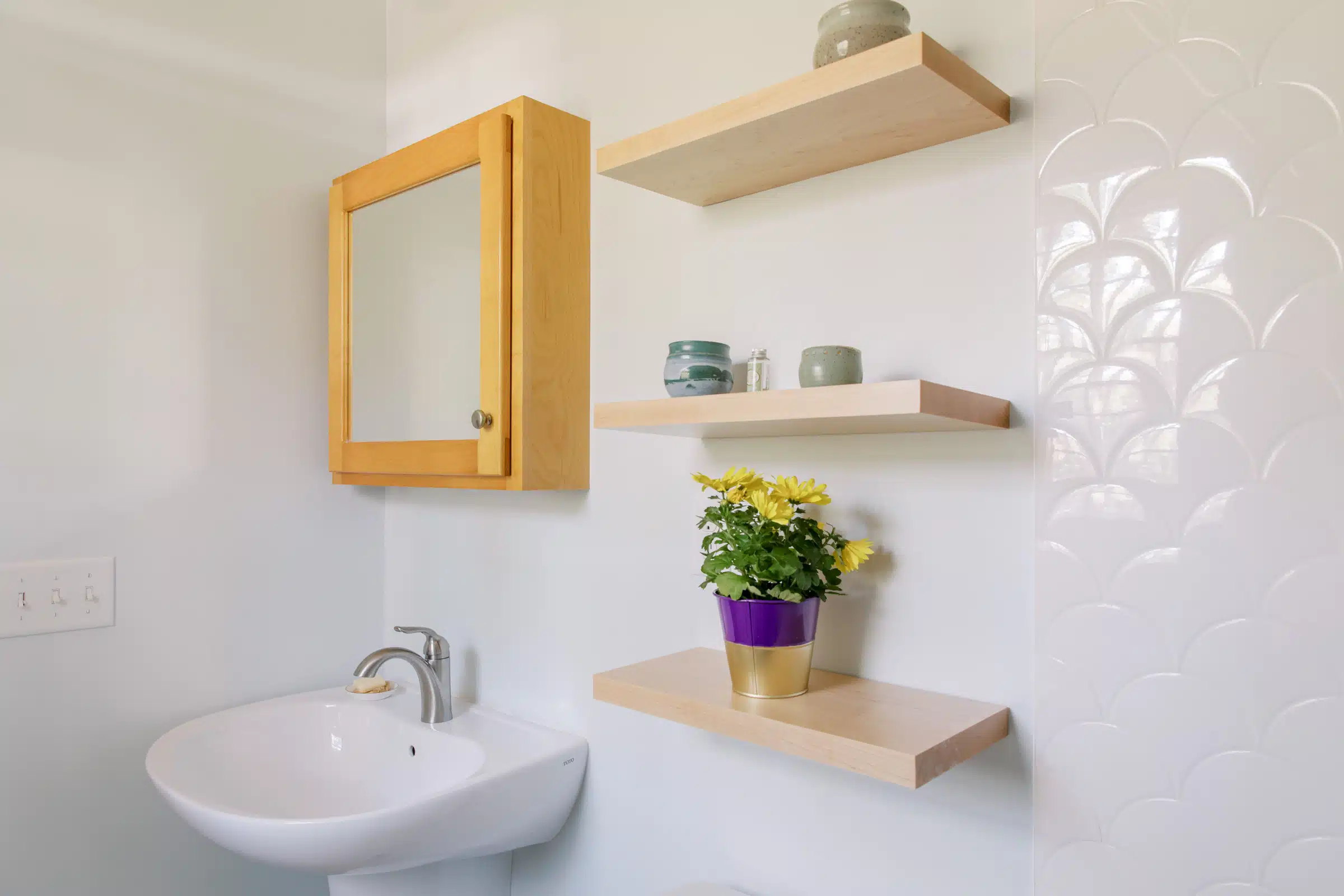 Bath Remodel with skirted wall hung sink and floating shelves