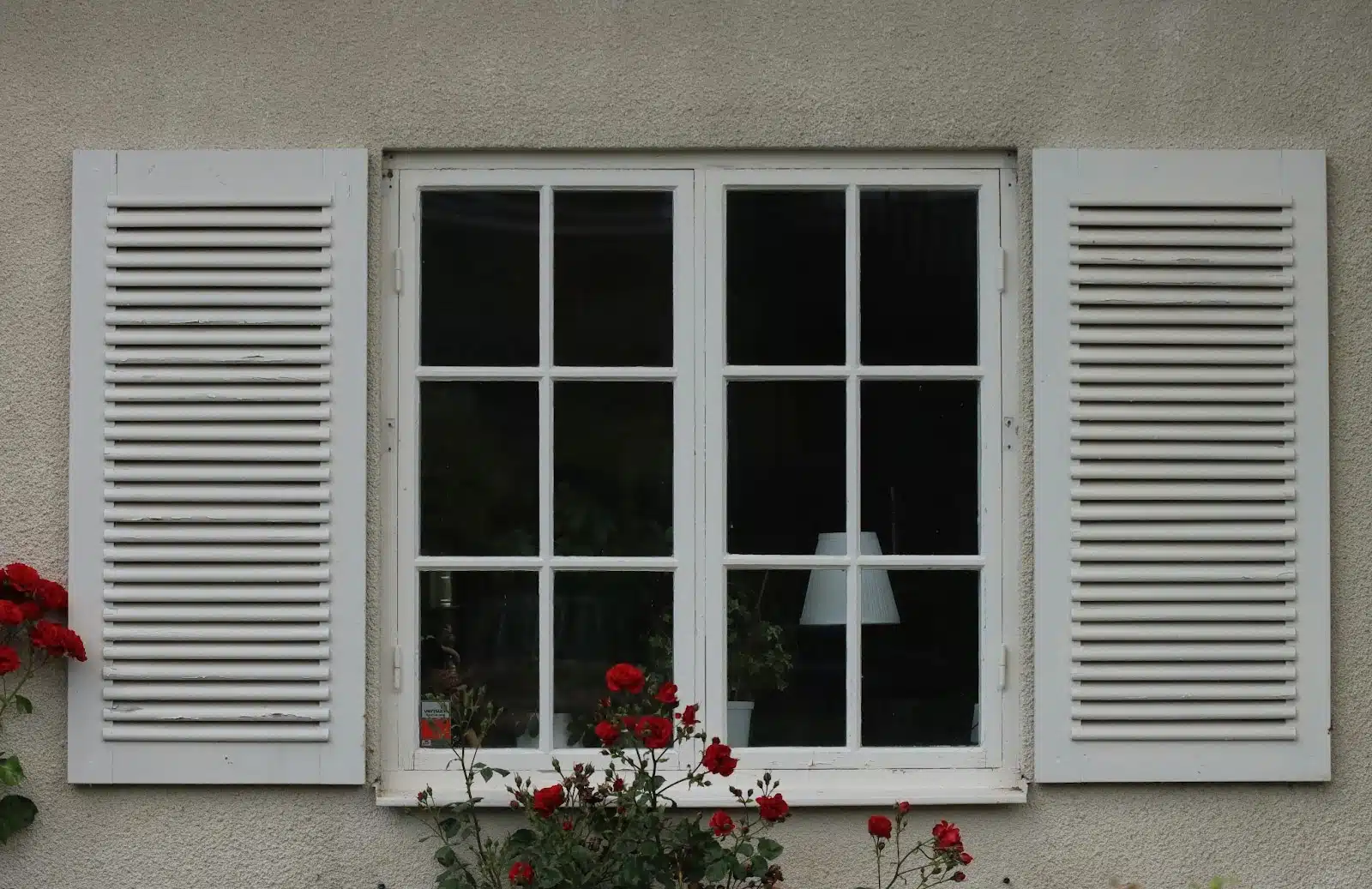 Window with White Frame and Shutters